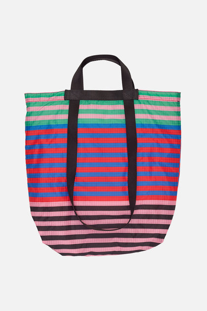 Funny missing link design, in black and blue. Tote Bag for Sale