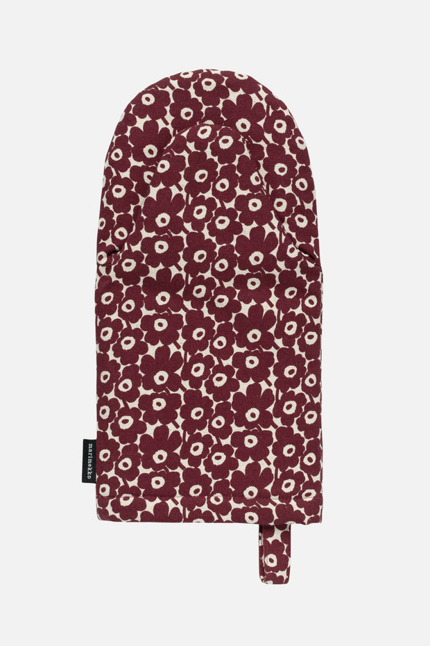 Floral patterned oven mitt on a white background